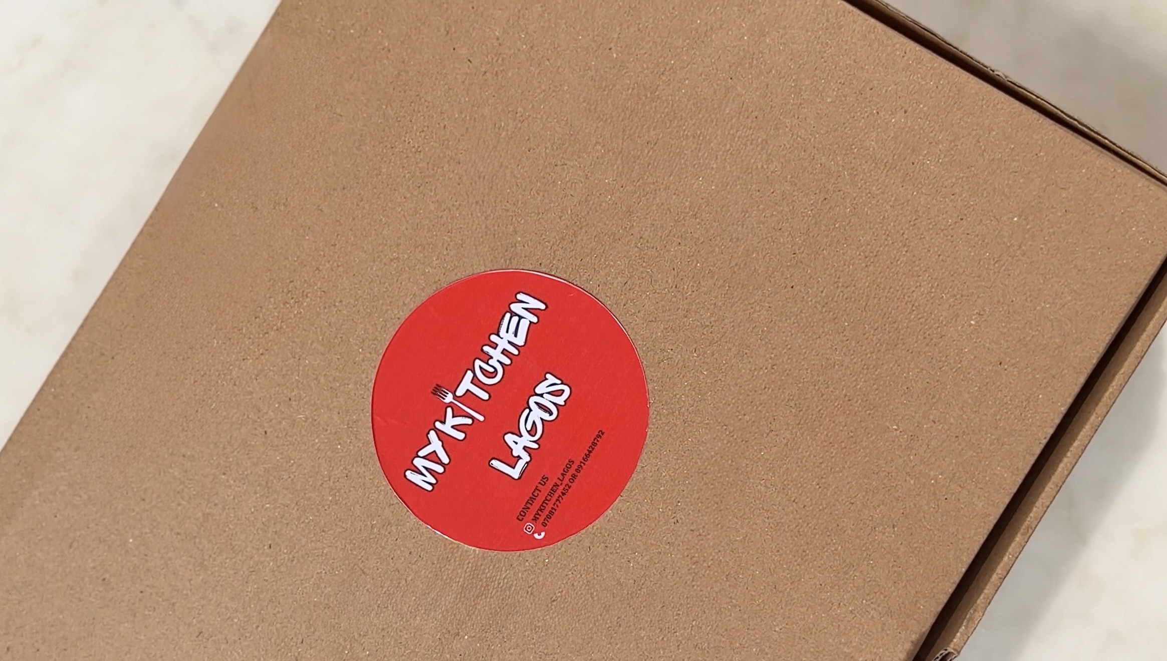 Delight Food Box sealed and ready, showing the My Kitchen Lagos branded box